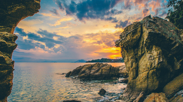 Sunset cave ocean rocky shore free wallpaper - medium preview image