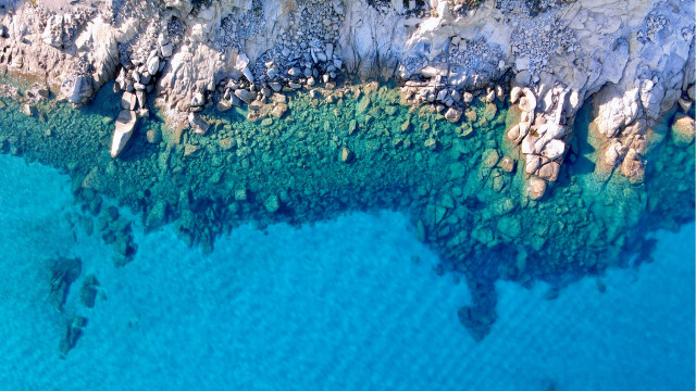 Rocky coastline aerial view boat free wallpaper - medium preview image