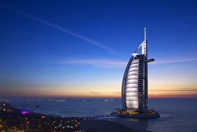 Tall building beach ocean night free wallpaper - medium preview image