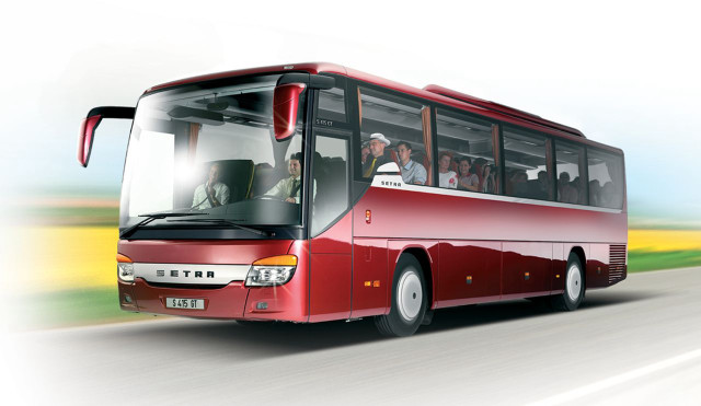 Red bus driving road people free wallpaper - medium preview image