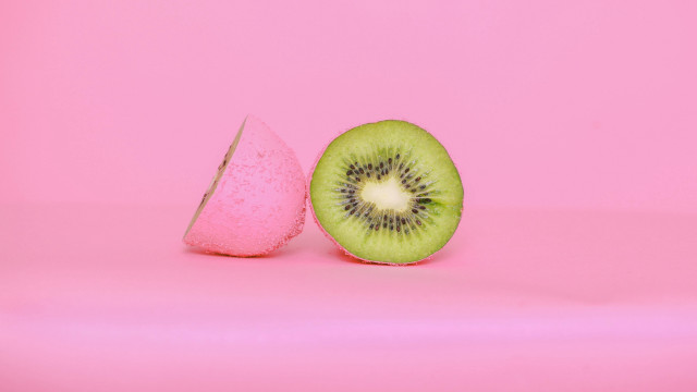 Kiwi slice pink background pink free wallpaper - medium preview image