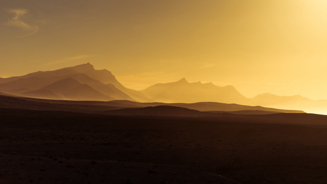 Mountain range yellow sky clouds free wallpaper - medium preview image