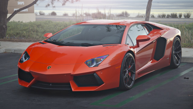 Red sports car parking lot #66 free wallpaper - medium preview image
