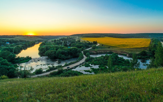 Lush green river hillside sunset free wallpaper - medium preview image