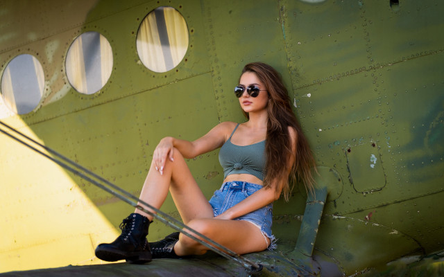Woman sitting plane arabesque fashion free wallpaper - medium preview image