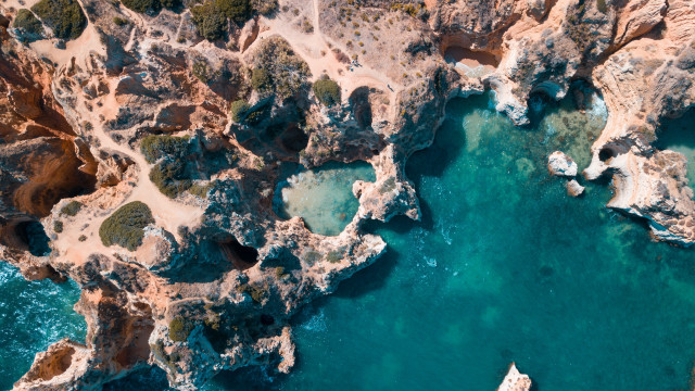 Boat rocky shore cliff blue free wallpaper - medium preview image