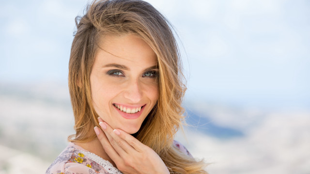 Smiling woman mountain background blonde free wallpaper - medium preview image
