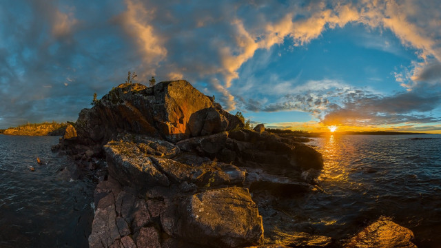 Sunset rocky shore island clouds free wallpaper - medium preview image