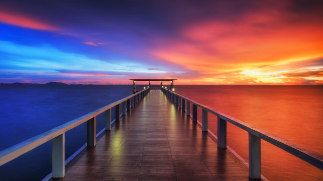 Pier sunset mystical colors cityscape free wallpaper - medium preview image