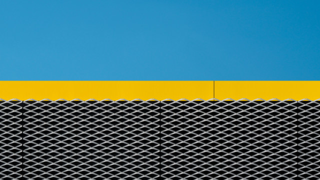 Yellow black building clock blue free wallpaper - medium preview image