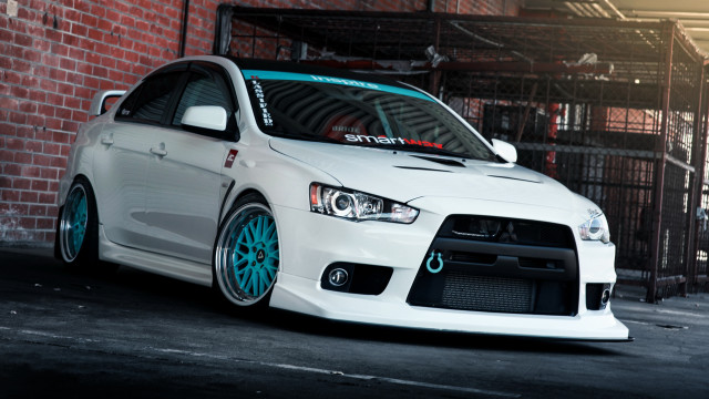 White car brick wall blue free wallpaper - medium preview image