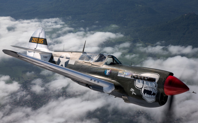 Fighter jet clouds mountains dieselpunk free wallpaper - medium preview image