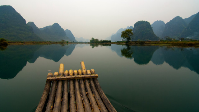 Bamboo raft lake mountains trees free wallpaper - medium preview image
