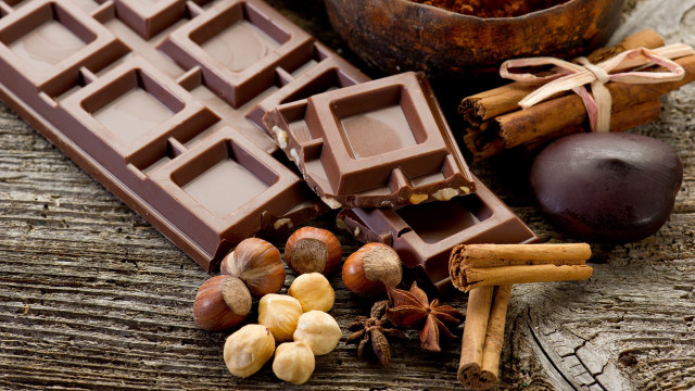 Chocolate nuts cinnamon wooden table free wallpaper - medium preview image