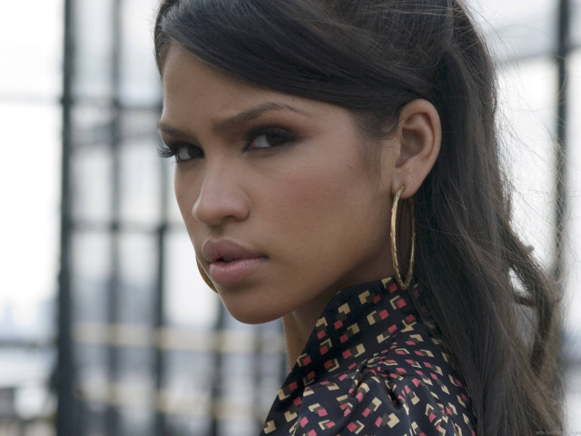 Woman ponytail earrings serious look free wallpaper - medium preview image