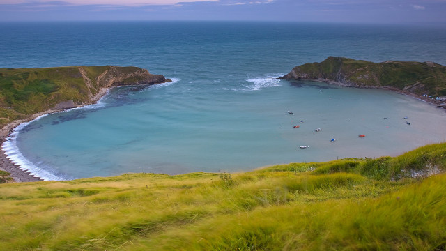 Beach water hill boat grassy free wallpaper - medium preview image