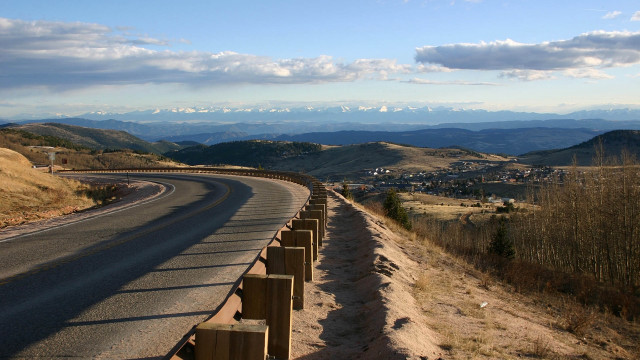 Mountain road fence sky ocean free wallpaper - medium preview image