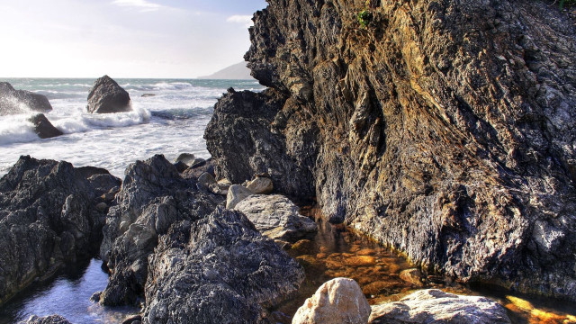 Rocky cliff water outcropping nature free wallpaper - medium preview image
