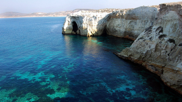 Ocean cliff beach boat cave free wallpaper - medium preview image