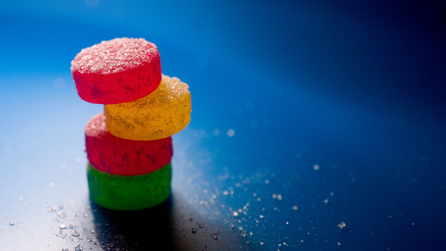 Gummy bears blue surface photorealism free wallpaper - medium preview image