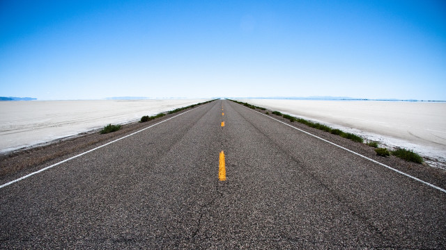 Empty road blue sky bushes free wallpaper - medium preview image