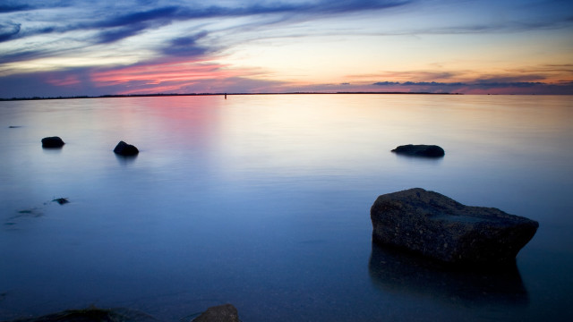 Sunset water rocks cloudy horizon free wallpaper - medium preview image