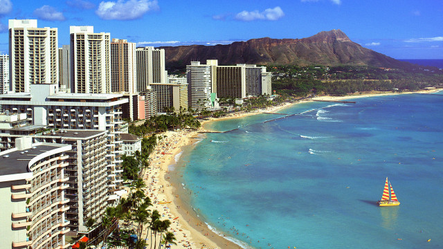 Sailboat beach cityscape mountains ocean free wallpaper - medium preview image