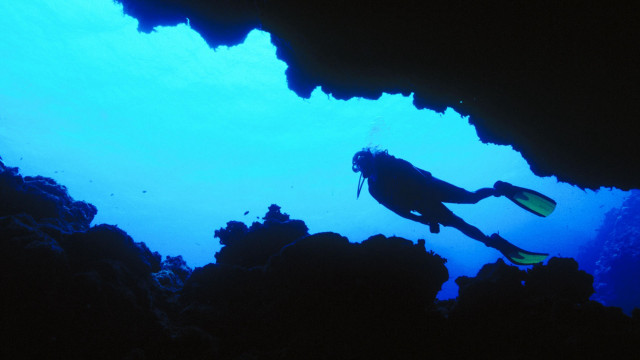 Scuba diver cave silhouette blue free wallpaper - medium preview image