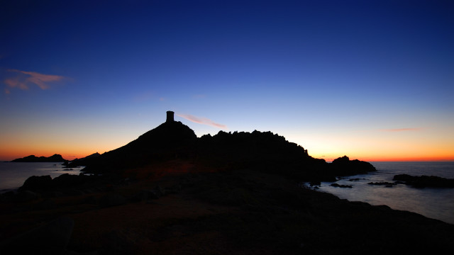 Lighthouse rock ocean sunset sky free wallpaper - medium preview image