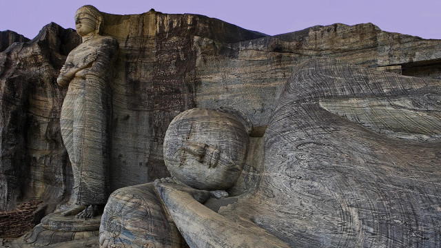 Statue person sitting mountain cliff free wallpaper - medium preview image