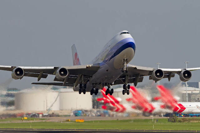 Jetliner cloudy sky runway flags free wallpaper - medium preview image