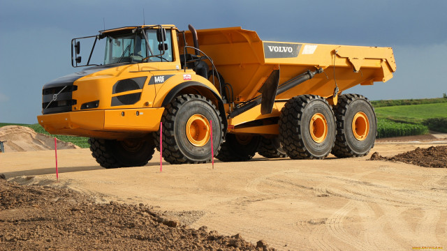 Yellow dump truck dirt field free wallpaper - medium preview image