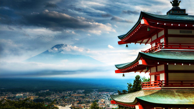 Tall red building mountain clouds free wallpaper - medium preview image