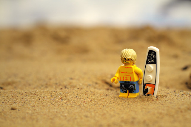 Lego man beach sand surfboard free wallpaper - medium preview image