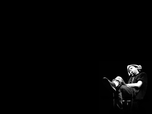Man sitting chair feet stool free wallpaper - medium preview image