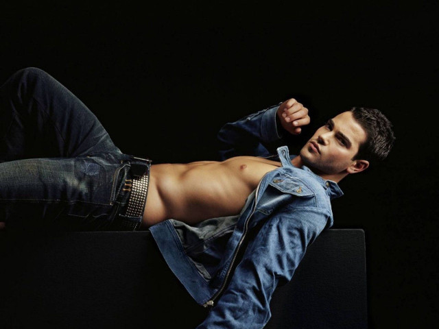 Man laying black surface shirt free wallpaper - medium preview image