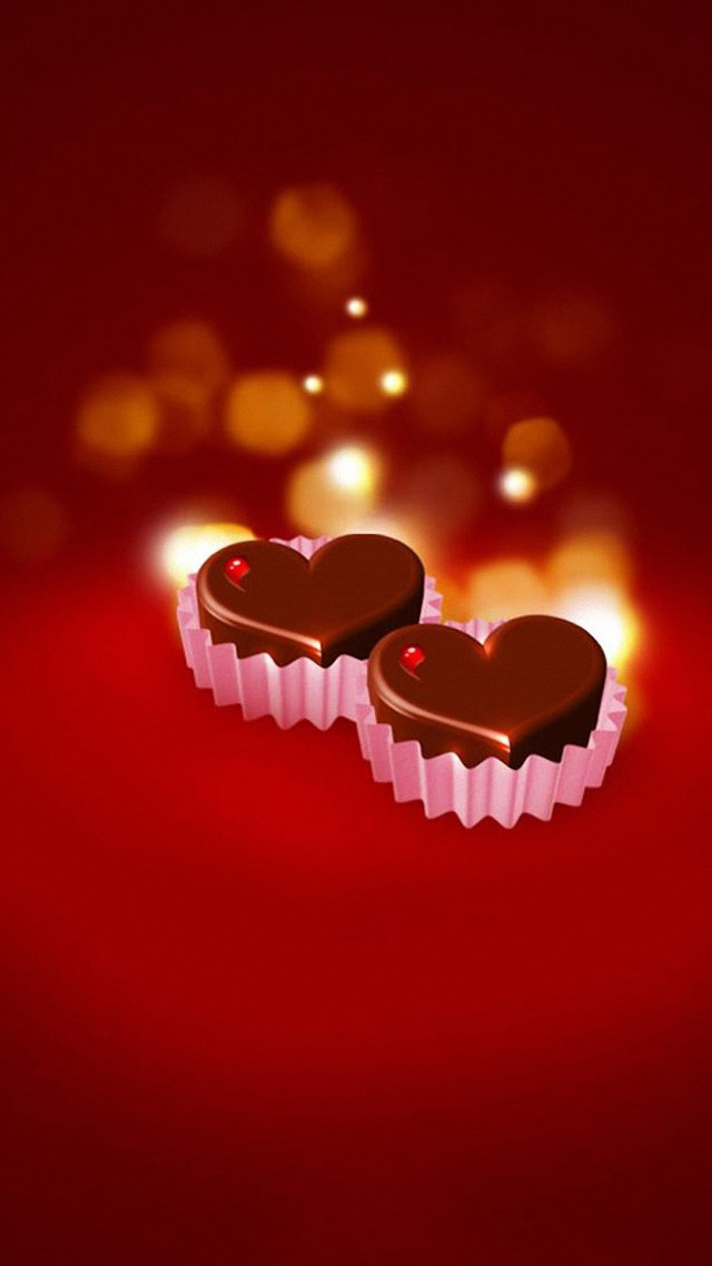 Heart shaped chocolates red background free wallpaper - medium preview image