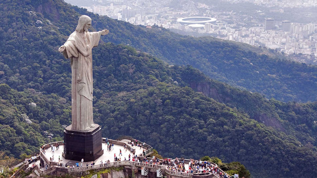 Jesus statue city mountain crowd free wallpaper - medium preview image