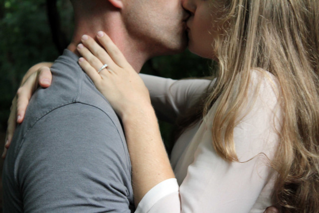 Man woman kissing trees bushes free wallpaper - medium preview image