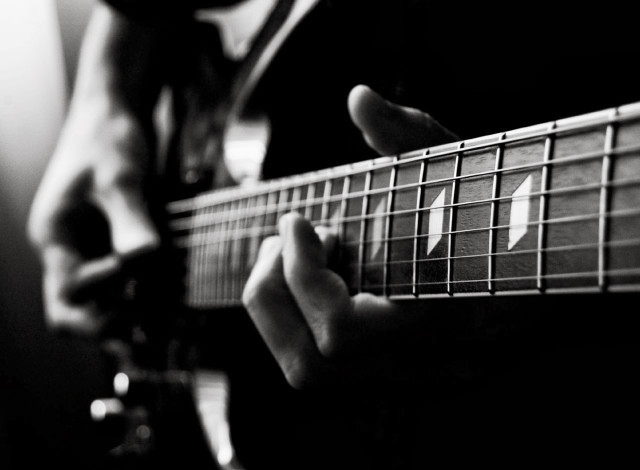 Person playing guitar fingers strings #2 free wallpaper - medium preview image