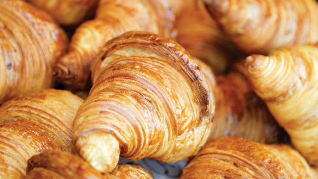 Croissants closeup table blurry background free wallpaper - medium preview image