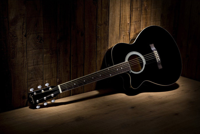 Guitar wooden table dark room free wallpaper - medium preview image