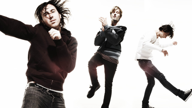 Three men jumping arms outstretched free wallpaper - medium preview image