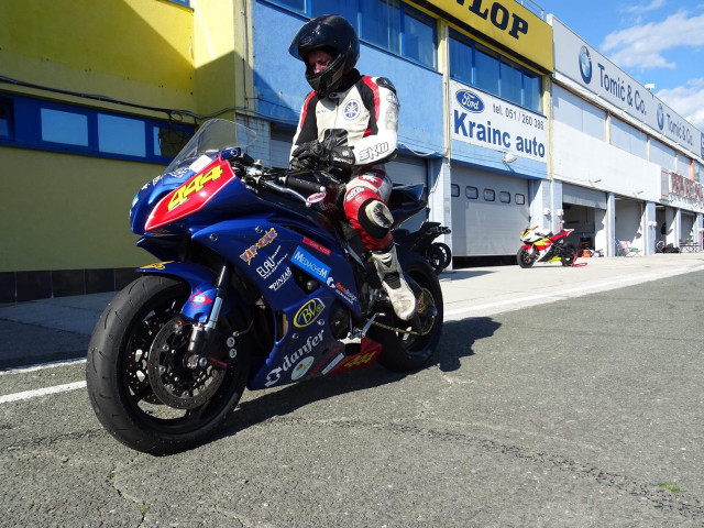 Man motorcycle street building yellow free wallpaper - medium preview image