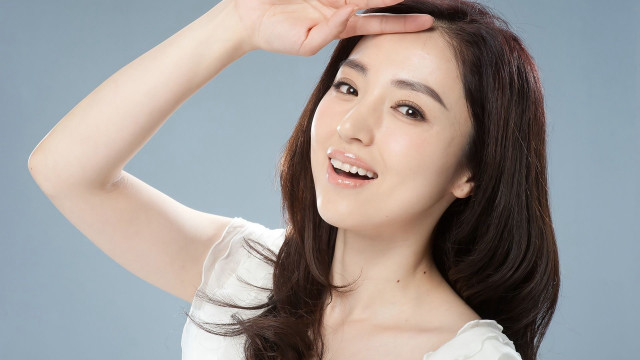 Woman long hair smiling touching free wallpaper - medium preview image