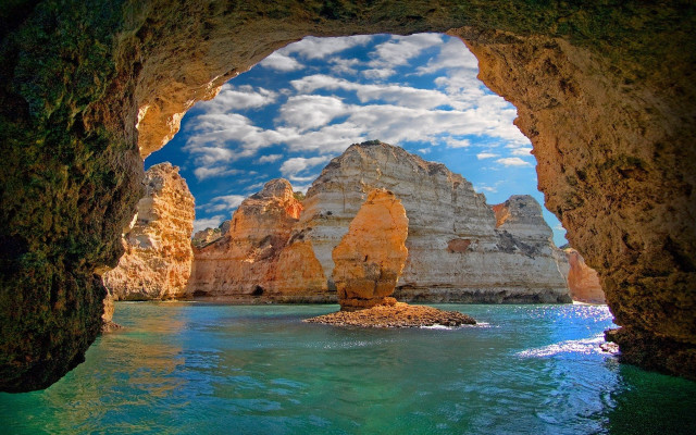 Cave ocean mountains sky boat free wallpaper - medium preview image