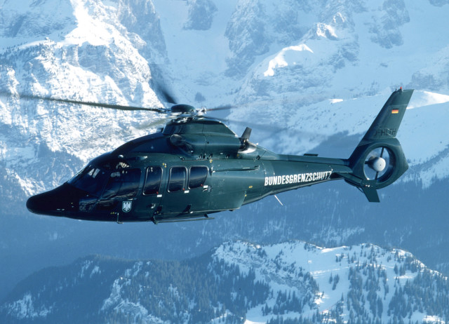 Helicopter flying mountain range sky free wallpaper - medium preview image