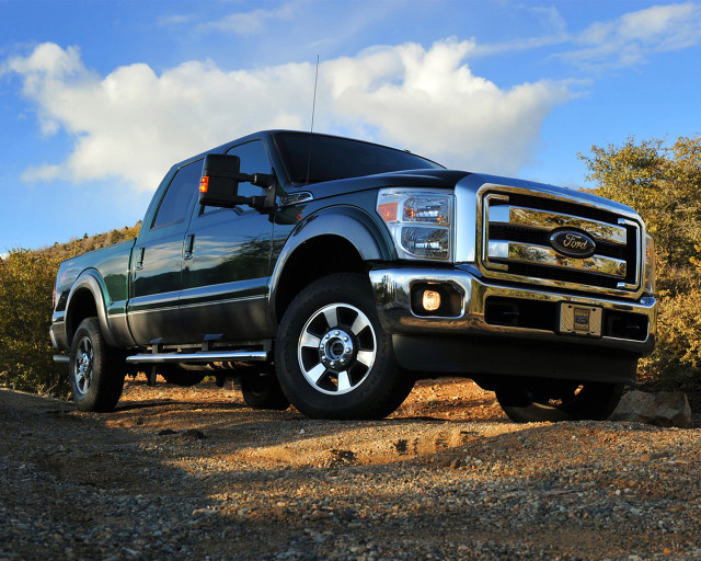 Black truck dirt road trees free wallpaper - medium preview image