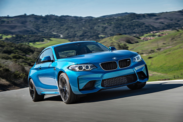 Blue bmw driving hillside landscape free wallpaper - medium preview image