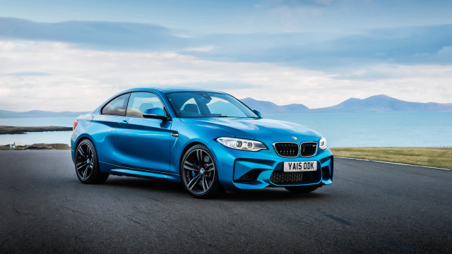 Blue bmw driving ocean mountains free wallpaper - medium preview image